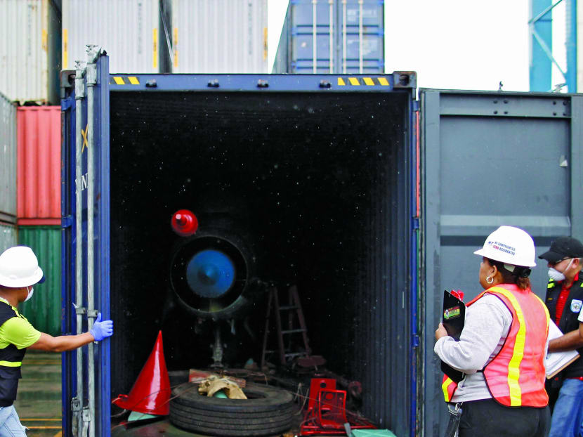 Panamanian forensic workers close a container holding a MiG-21 fighter jet seized from the North Korean-flagged ship Chong Chon Gang, during investigations at the Manzanillo Container Terminal in Colon city in this July 21, 2013 file photo. Photo: Reuters