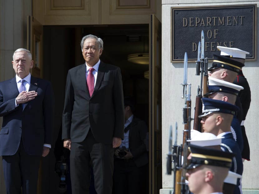 Secretary of Defense Jim Mattis and the Defence Minister of Singapore Ng Eng Hen stand for the playing of the U.S. National Anthem during a honor cordon to welcome Hen to the Pentagon for meetings, Wednesday, April 5, 2017. Photo: AP