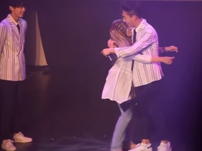 A girl hugs a member of South Korean band B14A in this YouTube video which went viral last January. Putrajaya says it has blacklisted the concert organiser for flouting entertainment regulations. Photo: The Malaysian Insider