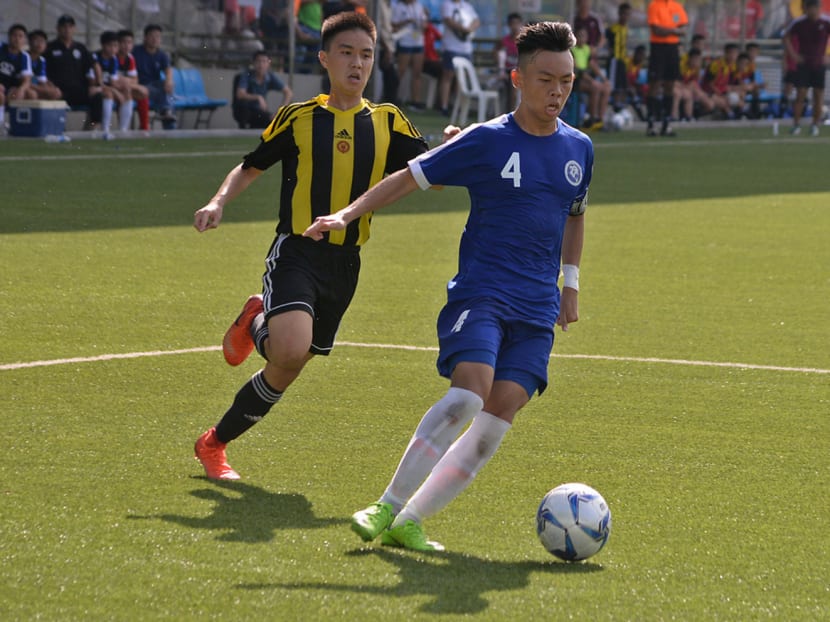 Midfielder Justin Hui (right) scored a hat-trick in the final to help Meridian JC clinch their ninth overall Boys ‘A’ Division championship trophy . Photo: Robin Choo