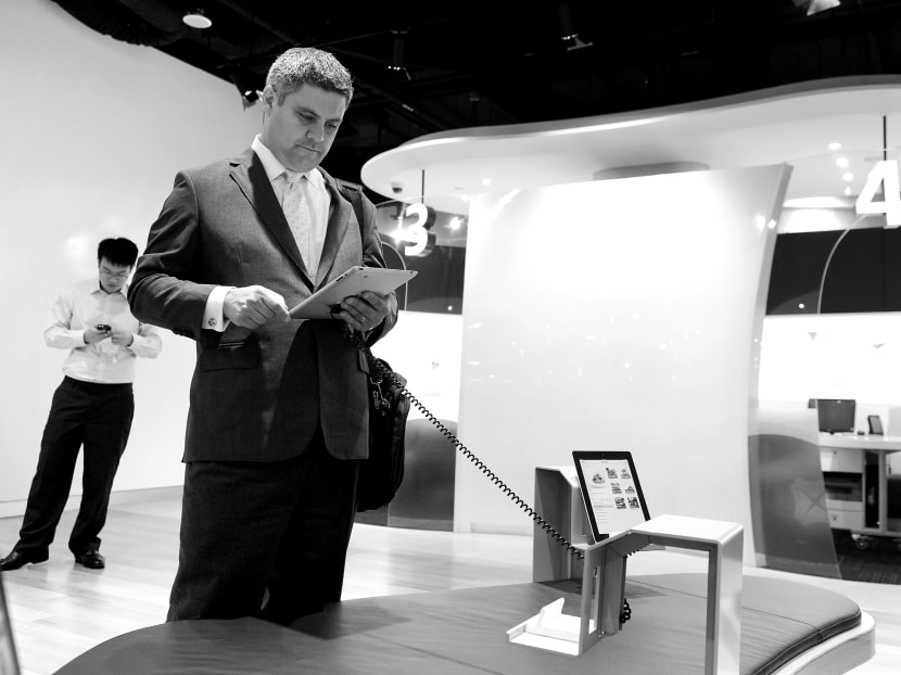 A customer using an iPad in DBS’ headquarters at the Marina Bay Financial Centre. The company has incorporated a design-thinking approach in how it engages with customers. Photo: Bloomberg