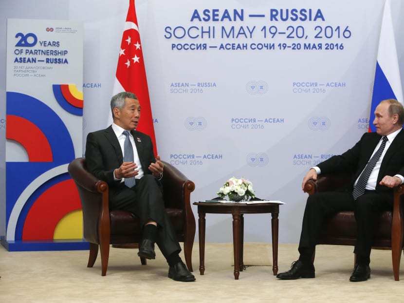 Russian President Vladimir Putin (right) meets Singapore Prime Minister Lee Hsien Loong on the sidelines of the Asean-Russia summit, in the Black Sea resort of Sochi, Russia. Photo: AP