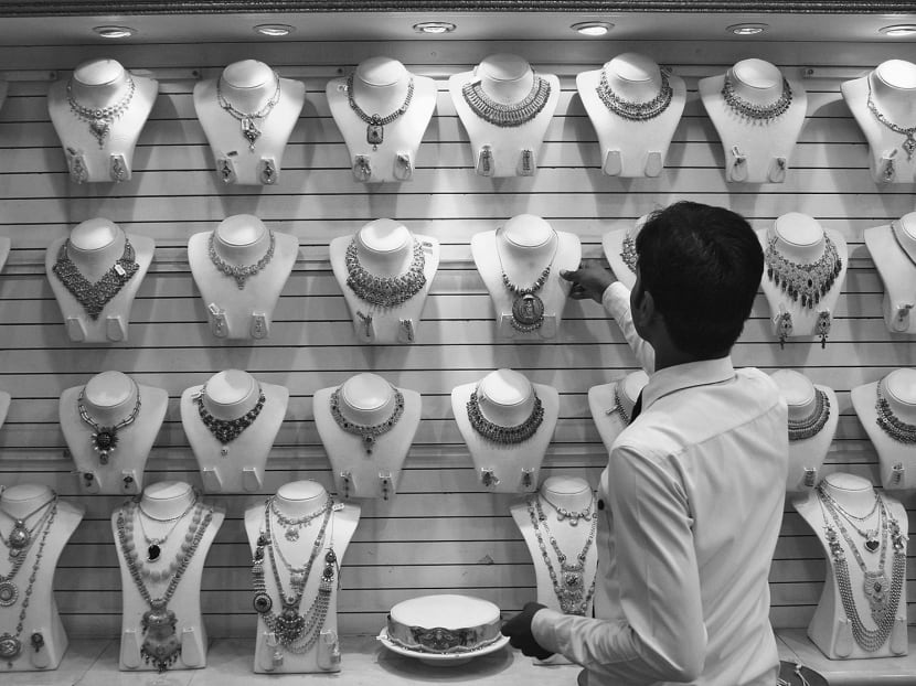 A salesman in a gold jewellery showroom in Kochi, India. A positive supply surprise may be seen in India, which ought to be the world’s fastest-growing major economy over the next two or three decades. Photo: Reuters