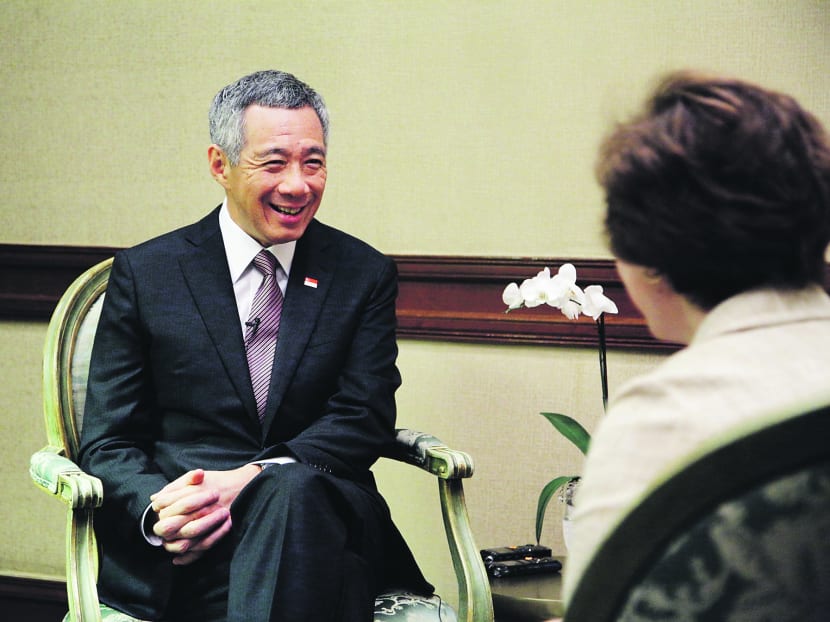 Mr Lee talking to Politico’s Susan Glasser. Photo: Ministry of Communications and Information