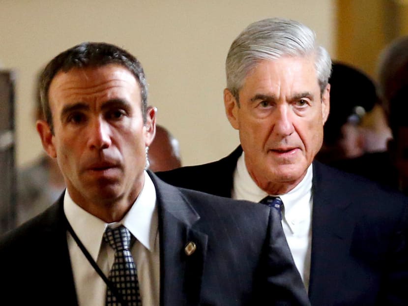Since May, Mr Robert Mueller’s (right) team of hard-nosed and deeply experienced federal prosecutors, FBI investigators, spy-chasers and money-path followers have been talking to witnesses and amassing files, the only hints of their work coming from requests they send to their targets. Photo: Reuters