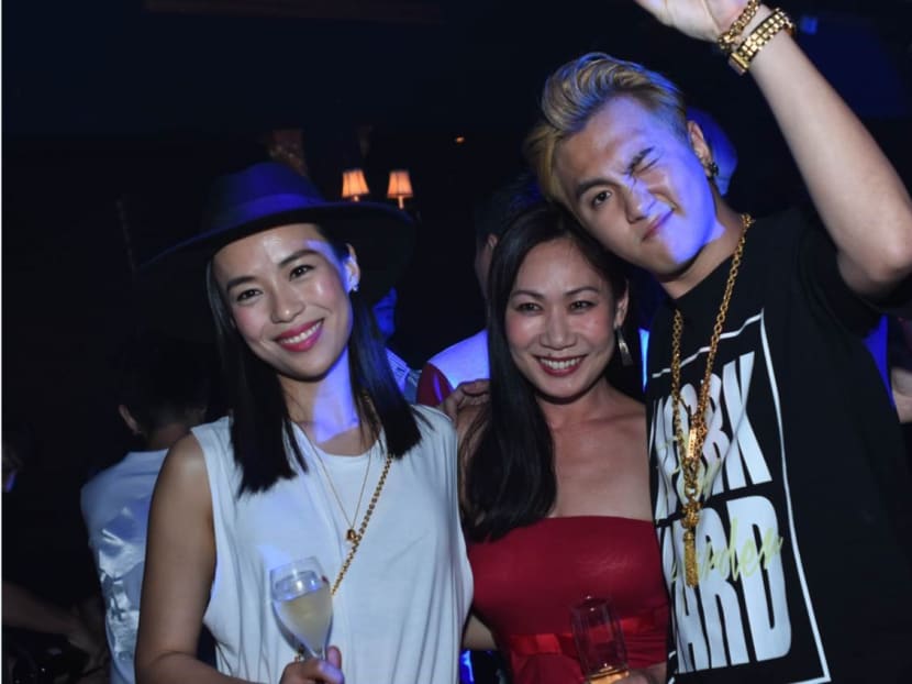 Ian Fang (right, seen here with actress Rebecca Lim and Mediacorp's Georgina Chang) at the anniversary bash for his fashion label, First Attempt.