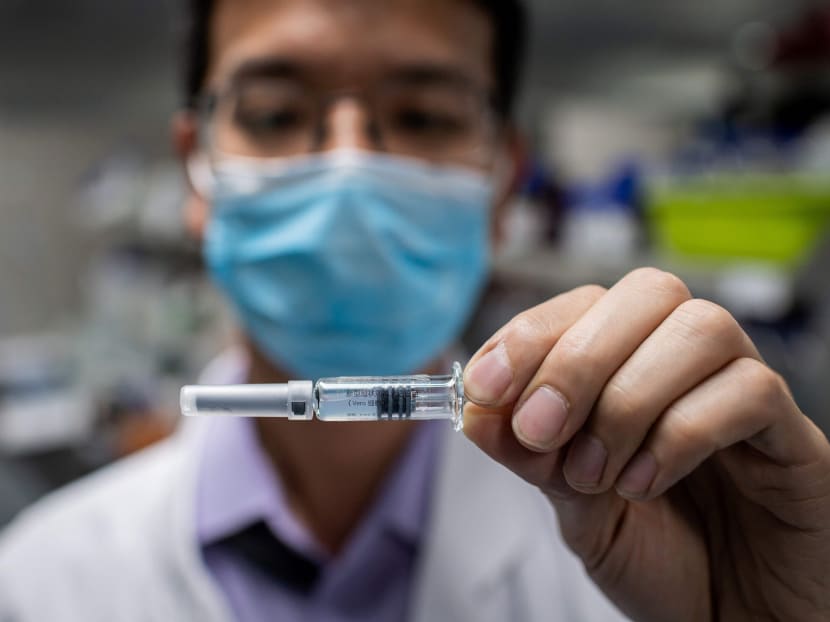 An engineer shows an experimental vaccine for the Covid-19 coronavirus that was tested in the Quality Control Laboratory at the Sinovac Biotech facilities in Beijing, China. An engineer shows an experimental vaccine for the Covid-19 coronavirus that was tested in the Quality Control Laboratory at the Sinovac Biotech facilities in Beijing, China.