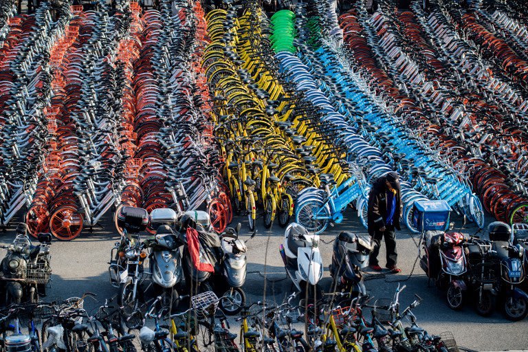 Bicycles from various bike-sharing schemes in China. AFP