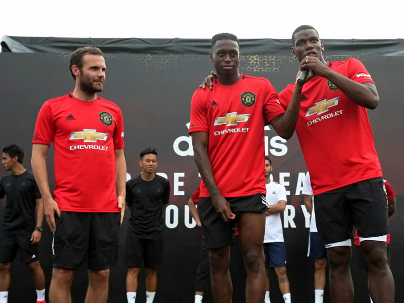 Manchester United stars Juan Mata, Aaron Wan-Bissaka and Paul Pogba greet their fans at the floating platform at Marina Bay on Sunday, July 21, 2019.