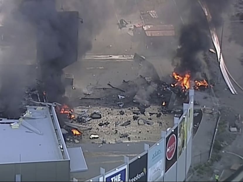 This image made from video shows the site of a plane crash at Essendon Airport in Melbourne on Feb 21 2017. An official says a light plane has crashed into a shopping mall in the city of Melbourne. Photo: Channel 9 via AP