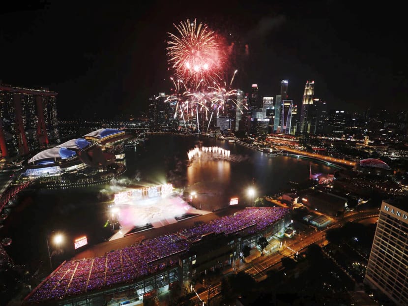 Fireworks go off over Marina Bay at the end of the National Day Parade 2018 celebrations on August 9, 2018.