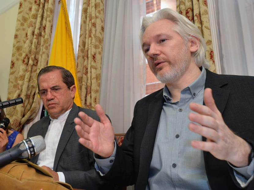 Ecuador's Foreign Minister Ricardo Patino (left) and WikiLeaks founder Julian Assange speak during a news conference inside the Ecuadorian Embassy in London on Aug 18, 2014. Whistleblower site WikiLeaks has put hundreds of thousands of emails and documents from last year's Sony hack into a searchable online archive. Photo: AP