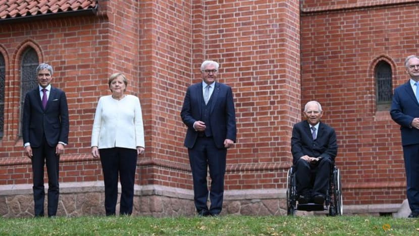 Emotional Merkel, marking German reunification, calls for tolerance Emotional Merkel, marking German reunification, calls for tolerance
