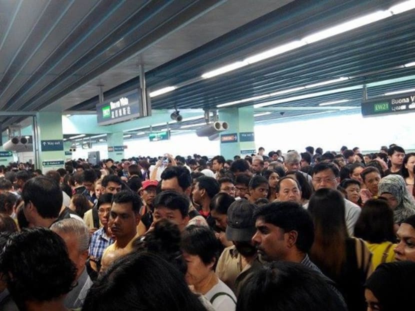 Commuters at Buona Vista Station after a train with brake fault caused delays. Photo: Channel NewsAsia