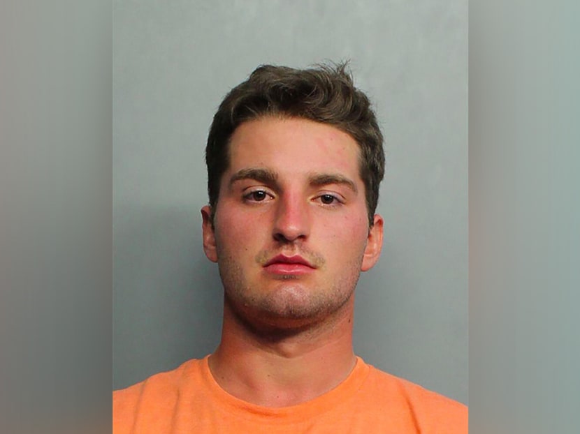A photo provided by Miami-Dade County Corrections shows Maxwell Berry, 22, who was arrested and charged with three misdemeanor counts of assault. A photo provided by Miami-Dade County Corrections shows Maxwell Berry, 22, who was arrested and charged with three misdemeanor counts of assault.