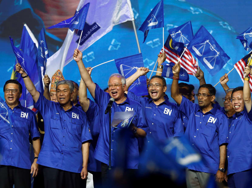 Malaysia's Prime Minister and president of ruling party National Front, Najib Razak and other party leaders wave the party flags during the launch of its manifesto for the upcoming general elections in Kuala Lumpur, Malaysia April 7, 2018.