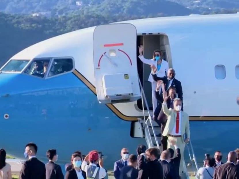 U.S. House of Representatives Speaker Nancy Pelosi waves with other members of the delegation as they board a plane before leaving Taipei Songshan Airport, in Taipei, Taiwan August 3, 2022, in this screengrab taken from video. REUTERS TV/Pool via REUTERS. NO RESALES. NO ARCHIVES. U.S. House of Representatives Speaker Nancy Pelosi waves with other members of the delegation as they board a plane before leaving Taipei Songshan Airport, in Taipei, Taiwan August 3, 2022, in this screengrab taken from video. REUTERS TV/Pool via REUTERS. NO RESALES. NO ARCHIVES.
