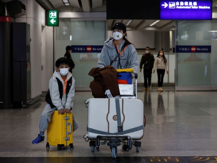 Travellers arrive at Hong Kong International Airport after the lifting of coronavirus disease (Covid-19) movement controls in Hong Kong, China Dec 14, 2022. Travellers arrive at Hong Kong International Airport after the lifting of coronavirus disease (Covid-19) movement controls in Hong Kong, China Dec 14, 2022.