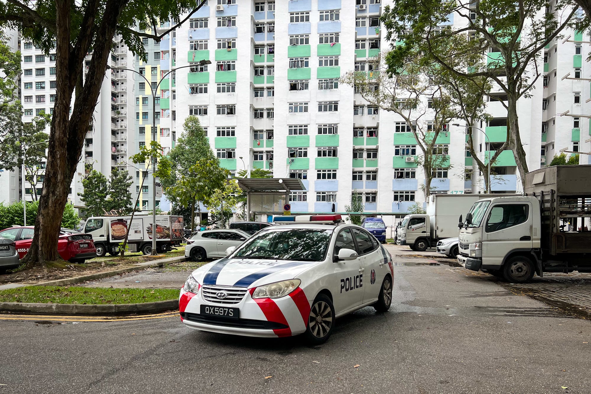 A police car seen patrolling the site of a Boon Lay Drive attack at about 4.30pm on April 7, 2022. 