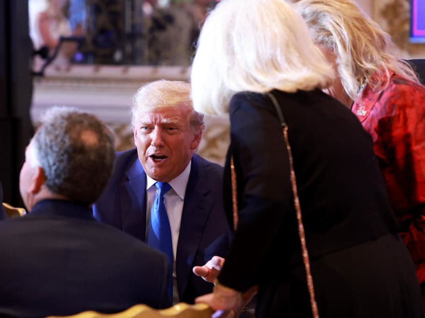 Former United States President Donald Trump mingles with supporters during an election night event at Mar-a-Lago on Nov 8, 2022 in Palm Beach, Florida. 
