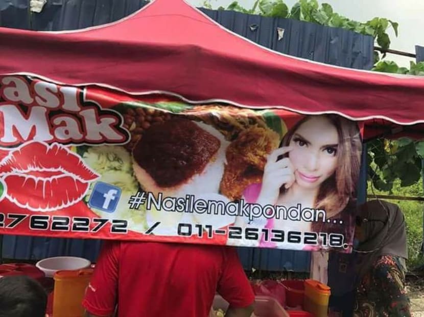 Although the owner of the controversial nasi lemak stall has toned down her appearance, she has decided to retain the stall's name. Photo: Facebook