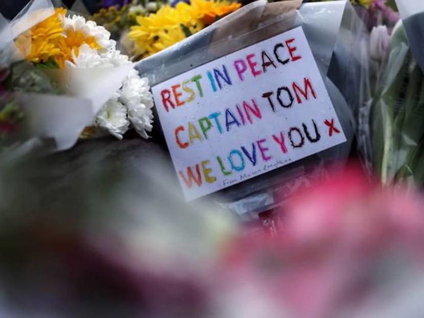 With tears and flowers, Britain mourns 'hero' Captain Tom Moore With tears and flowers, Britain mourns 'hero' Captain Tom Moore