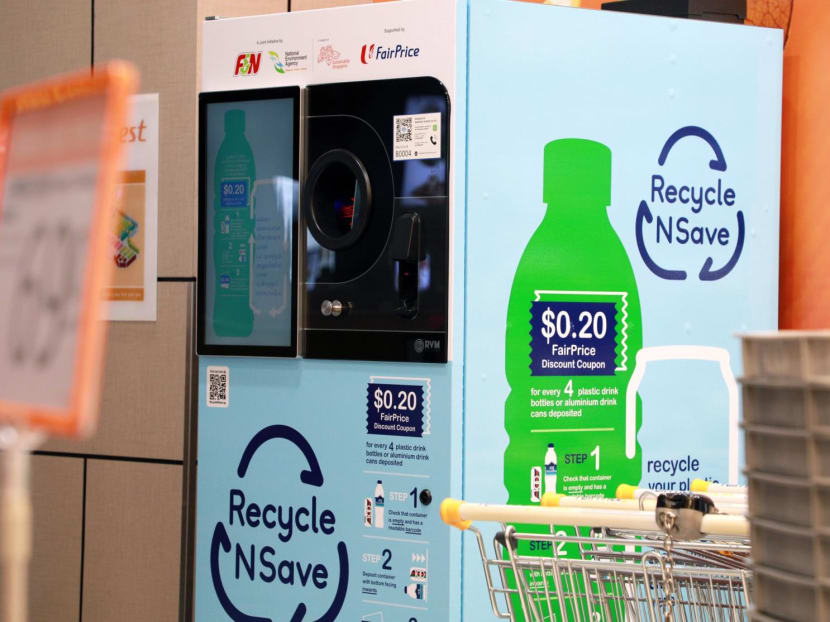 A reverse vending machine at a supermarket that accepts empty aluminium drink cans and plastic drink bottles for recycling, in return for a 20-cent supermarket discount voucher.