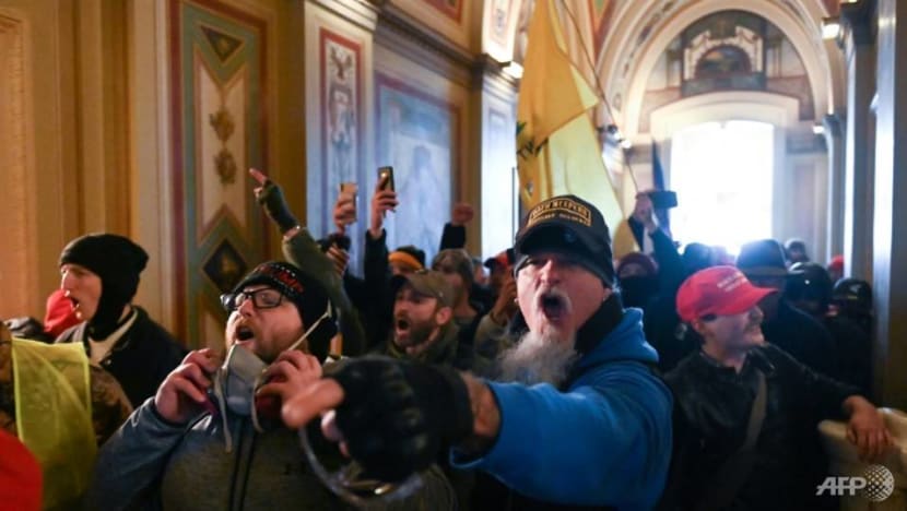 Guns and tear gas in US Capitol as Trump supporters attempt to overturn his loss
