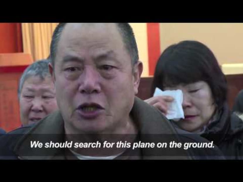 Desperate MH370 relatives urge governments to keep searching
