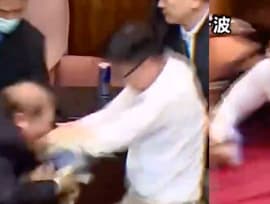 Taiwanese politician runs away with bill to stop it from being passed during parliament