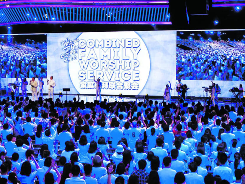 Thousands of worshippers wearing white at a Faith Community Baptist Church service in 2014. TODAY file photo