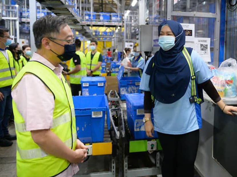 Trade and Industry Minister Gan Kim Yong visiting supermarket chain NTUC FairPrice's Benoi Distribution Centre and a cold warehouse at YCH's Supply Chain City on May 29, 2021.