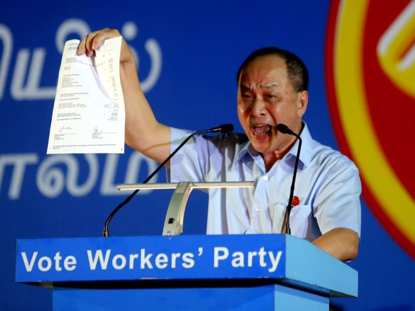 Workers' Party chief Low Thia Khiang holding up a copy of the audit form at the WP rally in Punggol on Sept 5, 2015. Photo: Raj Nadarajan