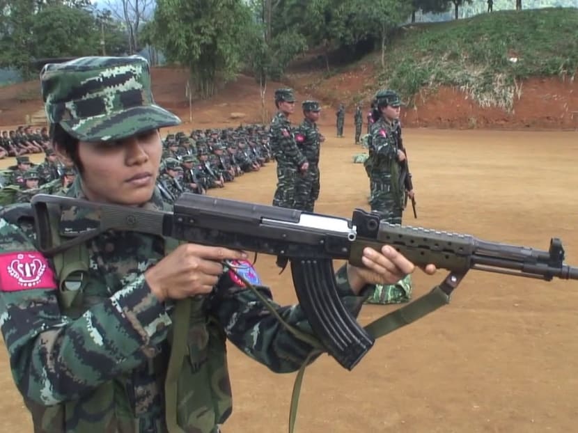 A female member of the Arakan Army holding an assault rifle during a training session. Investigations reveal that a group of Myanmar nationals in Singapore have organised and mobilised some members of the local Myanmar community to support the Arakan Army and its political wing, the United League of Arakan.