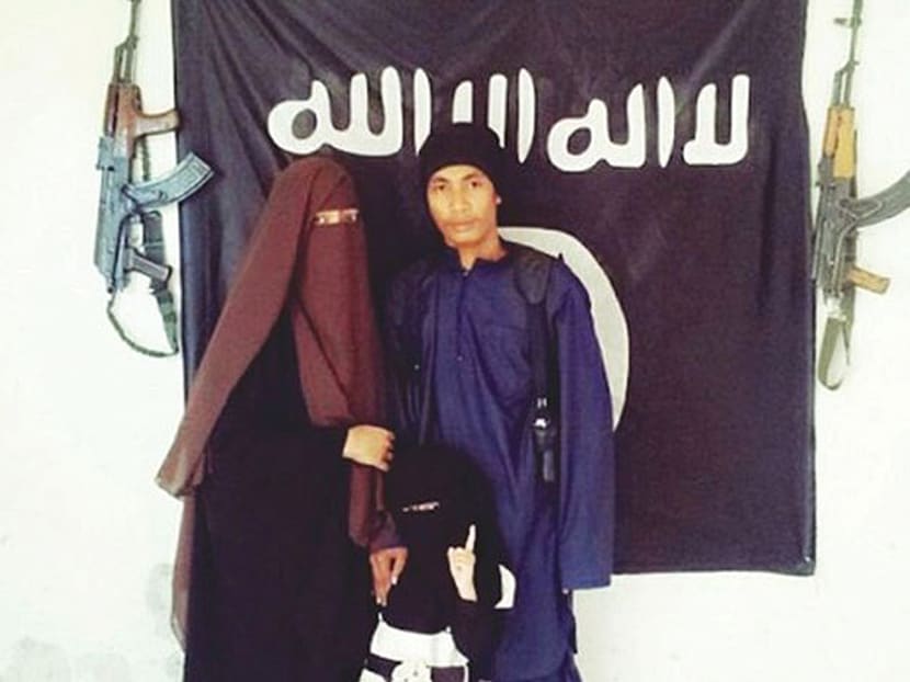 Muhammad Wanndy Mohamed Jedi with his wife and their child in Syria. Photo: Malay Mail Online