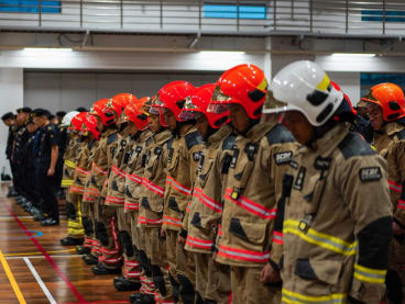 SCDF officers observe a minute of silence for the late CPT Kenneth Tay Xue Qin at SCDF headquarters on May 20, 2024. 