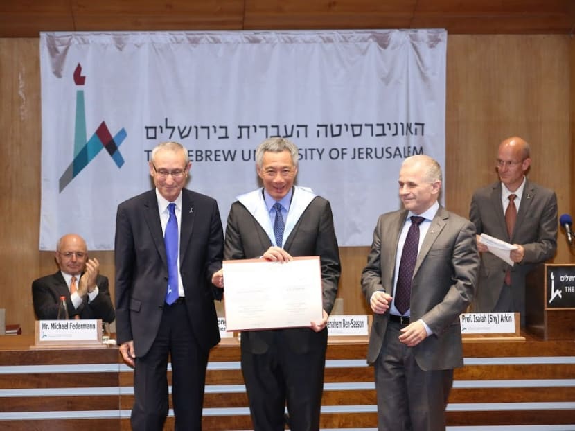 PM Lee receiving an honorary doctorate degree from Hebrew University’s Rector Asher Cohen (right) and President Menahem Ben-Sasson. Photo: MCI