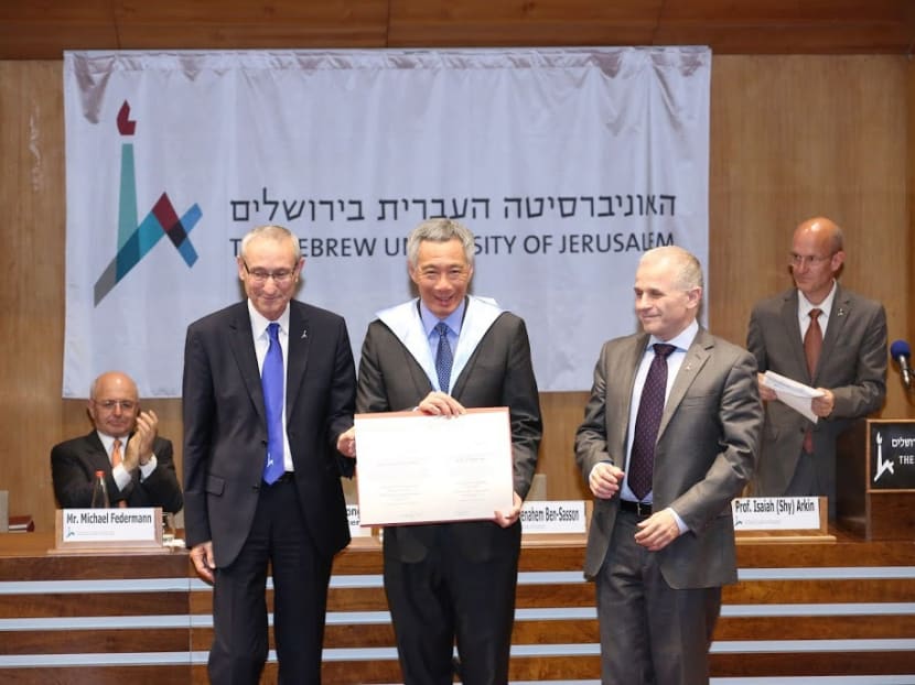 PM Lee receiving an honorary doctorate degree from Hebrew University’s Rector Asher Cohen (right) and President Menahem Ben-Sasson. Photo: MCI PM Lee receiving an honorary doctorate degree from Hebrew University’s Rector Asher Cohen (right) and President Menahem Ben-Sasson. Photo: MCI