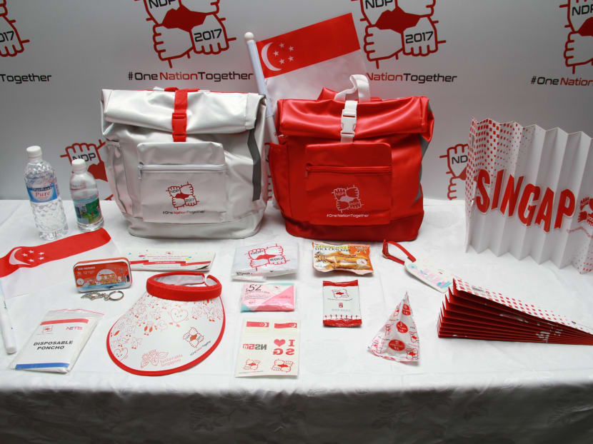 At 1.5kg, this year's National Day Parade funpack is one of the lightest to be distributed, and comes with snacks, water and other items such as a discount booklet and a luggage tag. Photo: Esther Leong/ TODAY