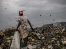 A ragpicker hunts for useful plastic items at a garbage dump in Chennai, India on July 7, 2022. India’s state of Tamil Nadu was not the country’s first to try to curtail plastic pollution, but unlike others it was relentless in enforcing its law. 