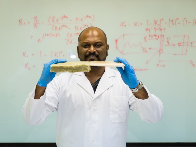 Dr Mahesh Sachithanadam holding the NTU thin foam with his left hand, comparing it to normal sound-proofing material. Photo: NTU