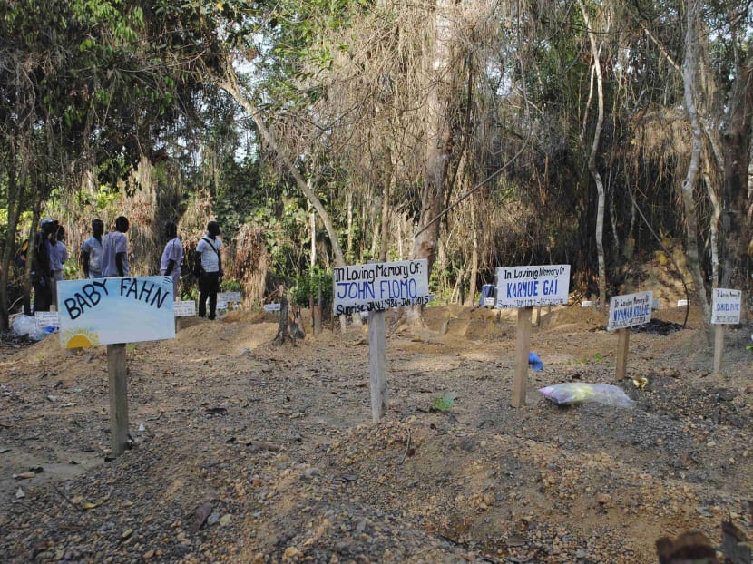 Nameplates are seen at a cemetery for victims of Ebola virus in Suakoko, Liberia, March 11, 2015.  Photo: Reuters