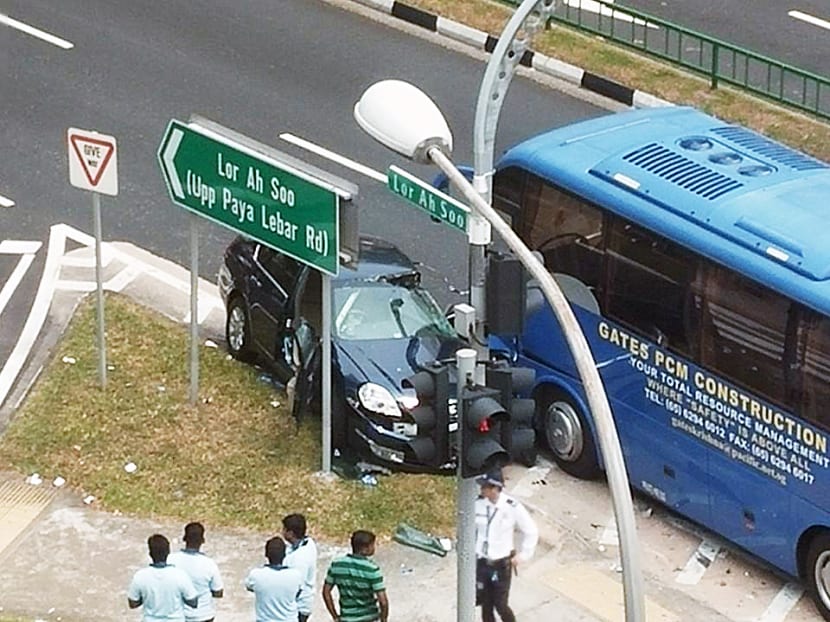 A car and a bus yesterday collided at the junction of 
Lorong Ah Soo and Hougang Avenue 1. Photo: Prem Kumar