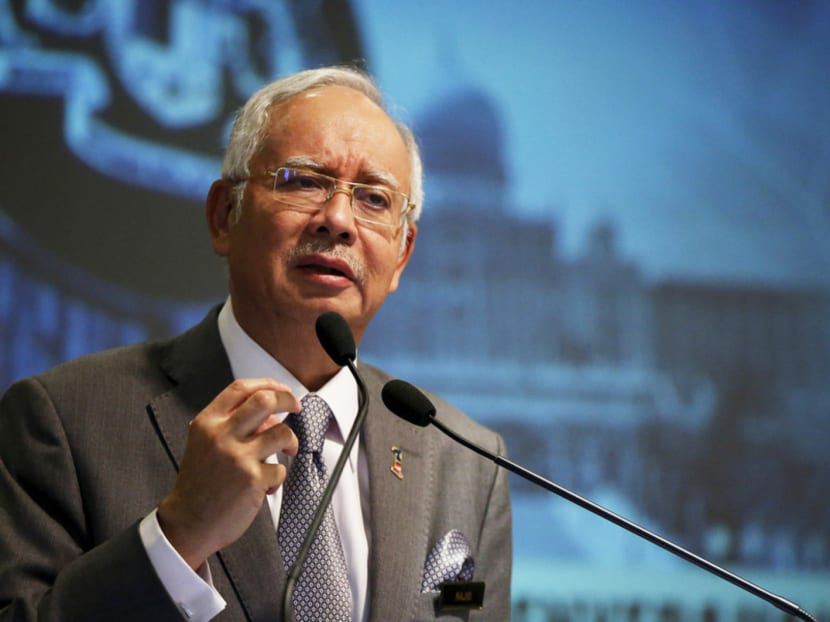 Malaysia's Prime Minister Najib Razak speaks at a presentation for government interns at the Prime Minster's office in Putrajaya, Malaysia, July 8, 2015. Malaysian police raided the office of troubled state investment fund 1MDB on Wednesday, following a report that claimed investigators looking into the firm found nearly $700 million had been transferred to Prime Minister Najib Razak's bank account. Najib has denied taking any money from 1MDB or any other entity for personal gain, and is considering legal action. Photo: REUTERS