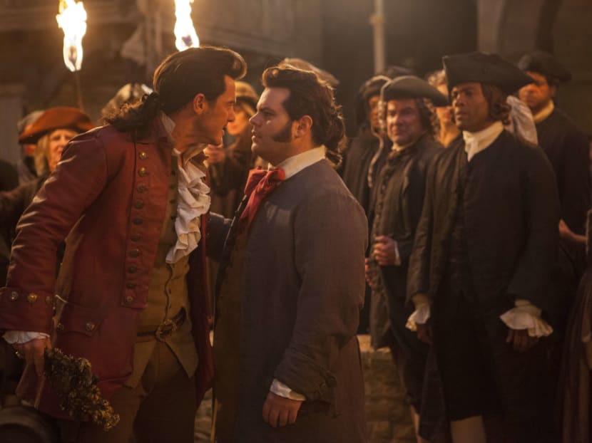 Luke Evans is Gaston and Josh Gad is LeFou, in Disney's Beauty and the Beast, a live-action adaptation of the studio's animated classic, directed by Bill Condon. Photo: Disney via AP