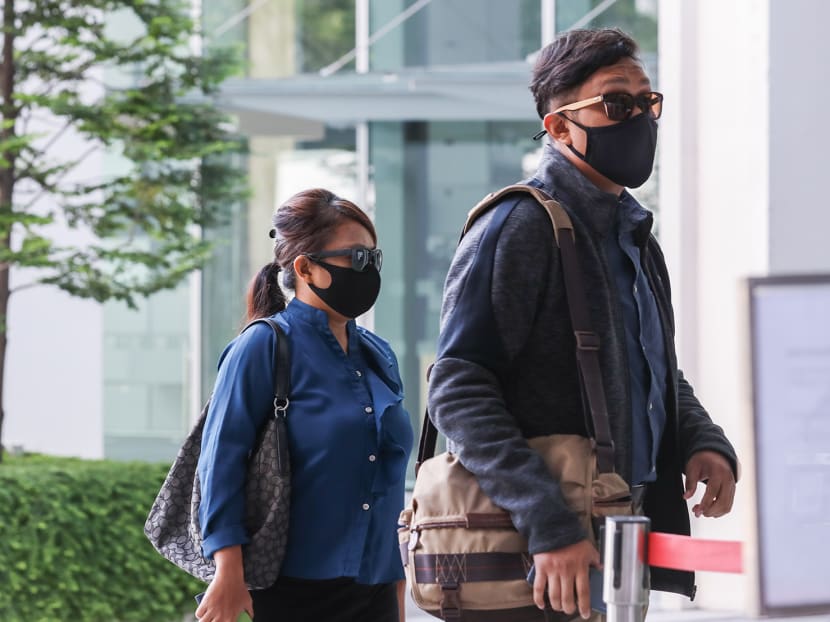 Khairul Annuar Zakaria (right) and Noorain Jubli are seen arriving State Courts on April 21, 2021.