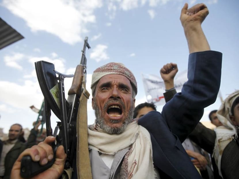 A follower of the Houthi shouts slogans as he raises his weapon during a rally against U.S. support to Saudi-led air strikes, in Yemen's capital Sanaa, March 1, 2016.  Photo: REUTERS