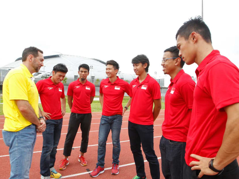 Head Coach of Sprints and Hurdles, Mr Luis Cunha (in yellow) having a light moment with 4 x100m relay team. TODAY file photo