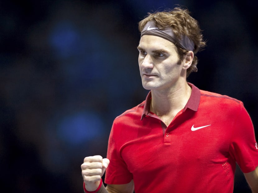Roger Federer of Switzerland celebrates winning a point in the round robin singles match against Kei Nishikori of Japan at the ATP World Tour Finals on Tuesday in London. Photo: Getty Images