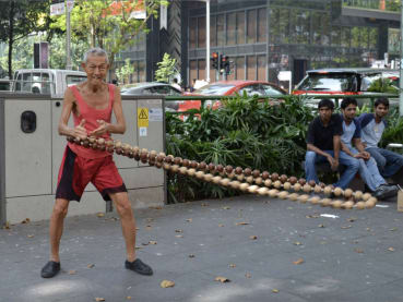 Orchard Road 'busking uncle’ Oh Ow Kee dies at 80: His beads were 'everything to him'